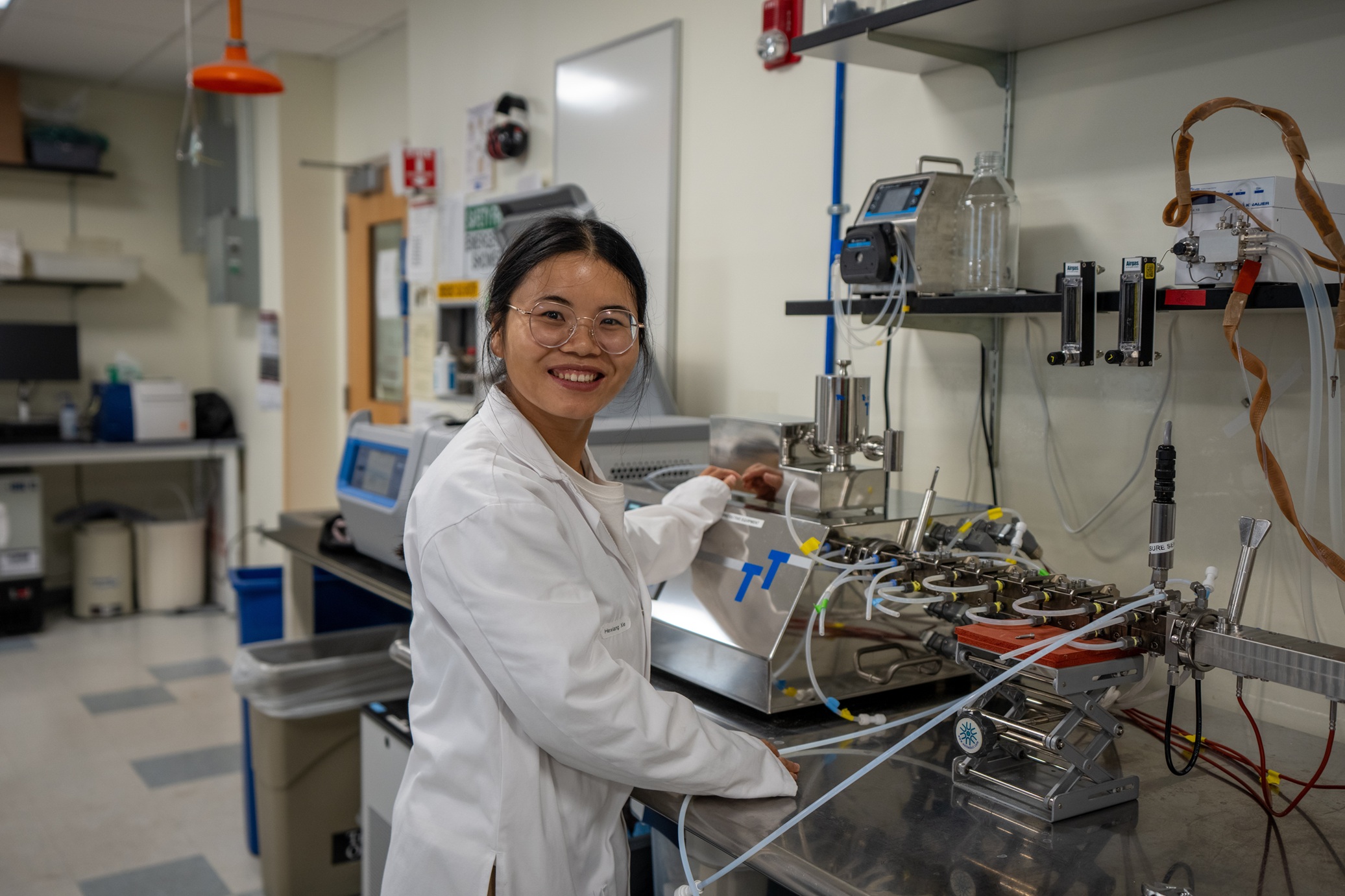 Researcher working with fermentation equipment