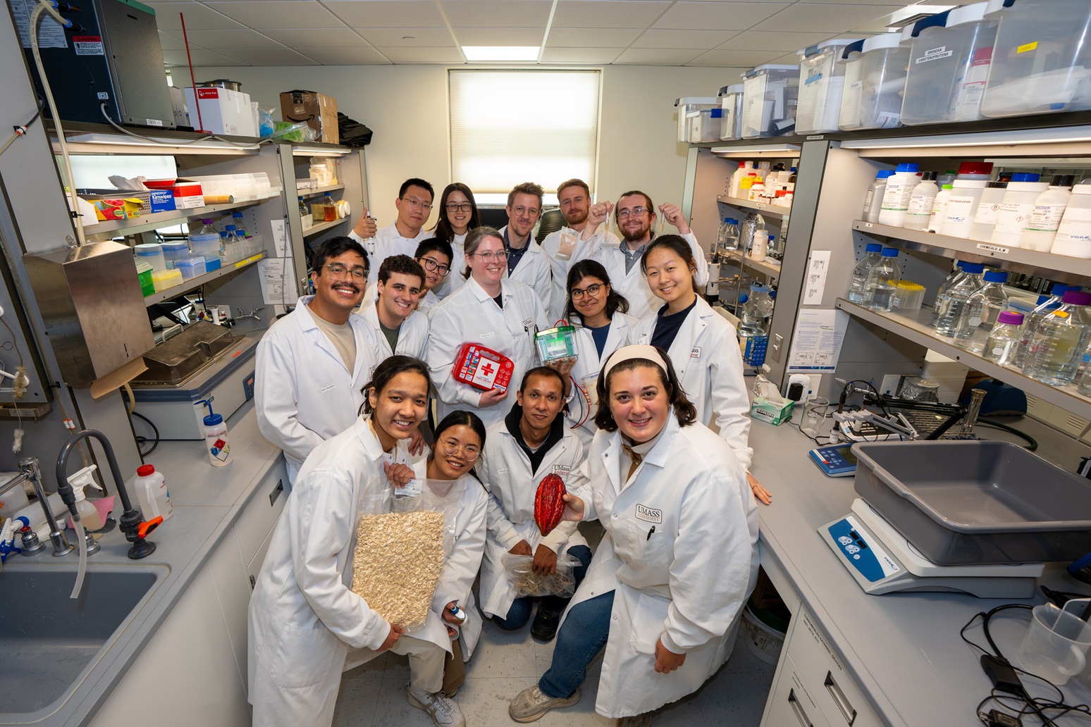 Lab group photo with research materials
